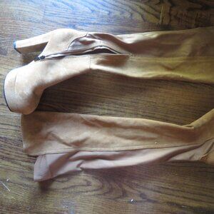 Thigh high boots with chunky 4" to 5" heel.